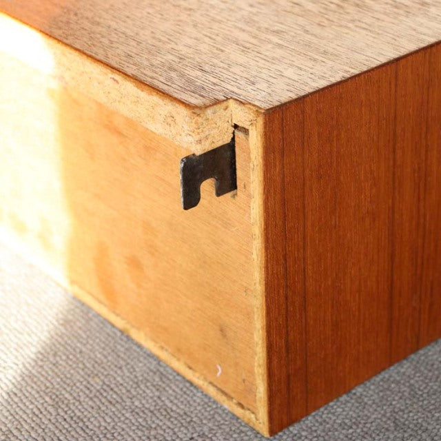 Vintage mid-century teak cabinet corner showing smooth wood grain and Danish craftsmanship by Preben Sørensen for Randers.