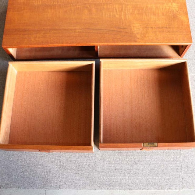 Vintage teak mid-century cabinet drawers designed by Preben Sørensen for Randers Møbelfabrik, showcasing smooth wood grain.