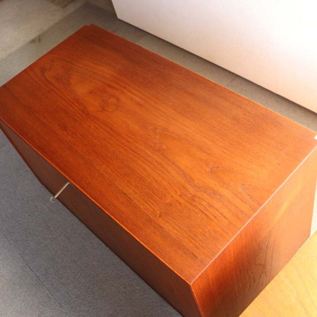 Vintage mid-century Danish teak cabinet top showing smooth wood grain and warm honey tones from PS system by Preben Sørensen .
