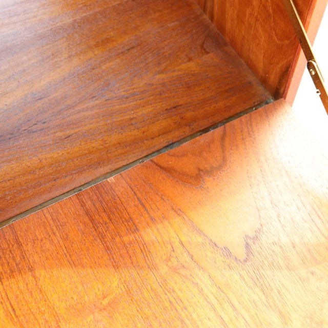 Close-up of vintage teak cabinet interior showing rich wood grain and smooth mid-century finish by Danish PS system Preben.