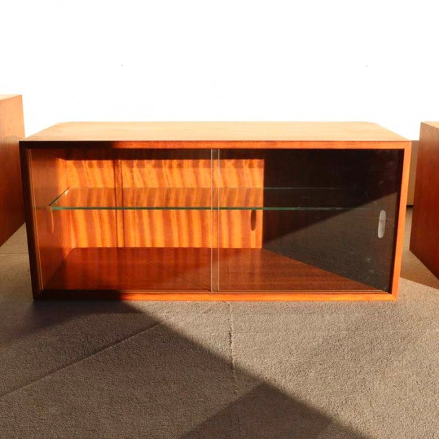 Mid-century vintage teak cabinet by Preben Sørensen for Randers Møbelfabrik, featuring clear glass sliding door and floating .