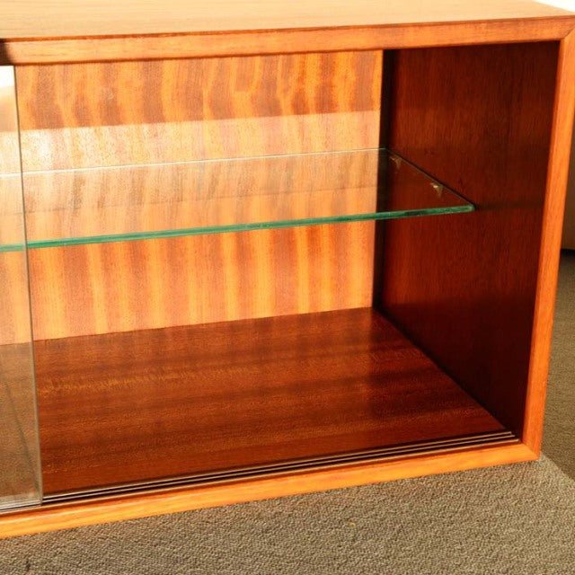 Mid-century vintage teak cabinet by Preben Sørensen for Randers Møbelfabrik, featuring clear glass shelf and rich wood grain.
