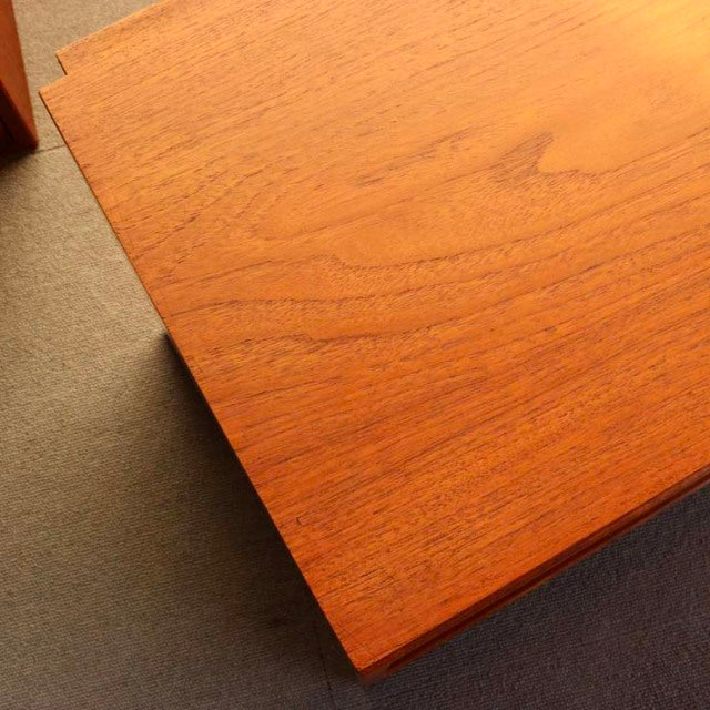 Close-up of vintage mid-century teak cabinet top showing warm wood grain and smooth surface from Denmark's PS system by.