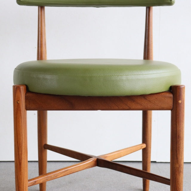 Vintage teak G-PLAN dining chair with olive green cushioned seat, mid-century British design, slender wooden legs with cross .