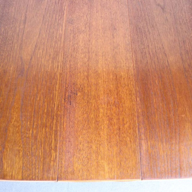 Vintage teak wood tabletop with rich grain pattern from British mid-century JENTIQUE drop-leaf table.