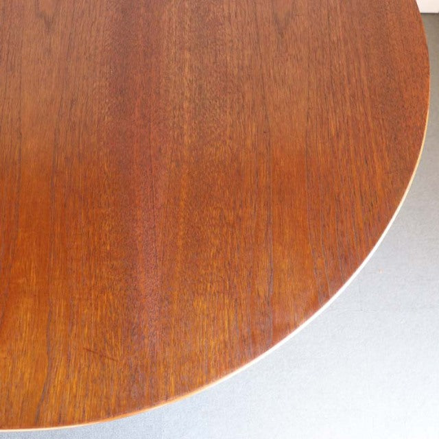 Vintage teak drop-leaf table by Jentique with smooth rounded edge and warm mid-century wood grain.