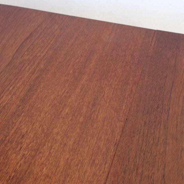 Vintage teak drop-leaf table top showcasing rich wood grain and smooth mid-century British craftsmanship.