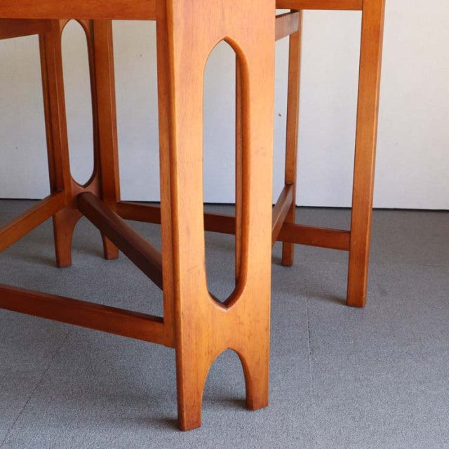 Mid-century vintage teak drop-leaf table leg with oval cutout, British-Denmark design, smooth wood grain.