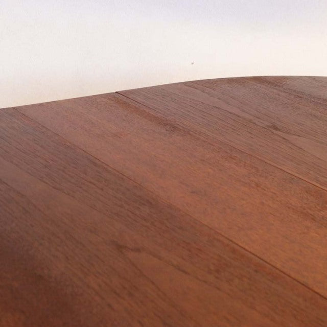 Vintage teak drop-leaf table with rich wood grain and smooth finish, British mid-century design by Jentique.
