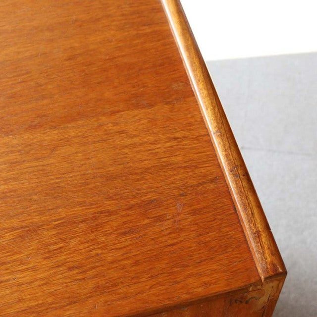 Close-up of vintage teak wood grain and smooth edge on mid-century British Nathan storage cabinet from Denmark.