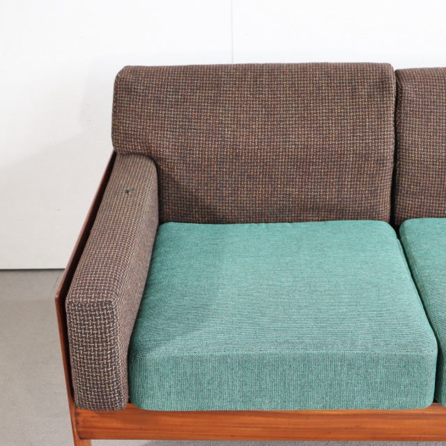 Vintage mid-century two-seater sofa with British Harris Tweed textured brown fabric, teal new seat cushions, and teak wood.