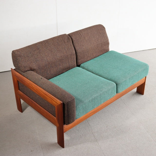 Vintage teak British mid-century two-seater sofa with clean lines, brown Harris Tweed back cushions, fresh teal seat.