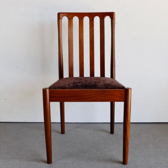 Vintage Meredew teak dining chair with vertical slat back, tapered legs, and brown upholstered seat, mid-century British.
