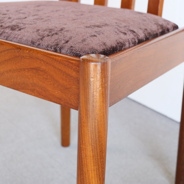 Vintage teak dining chair leg from Meredew, showcasing smooth mid-century British craftsmanship with rich wood grain and a.