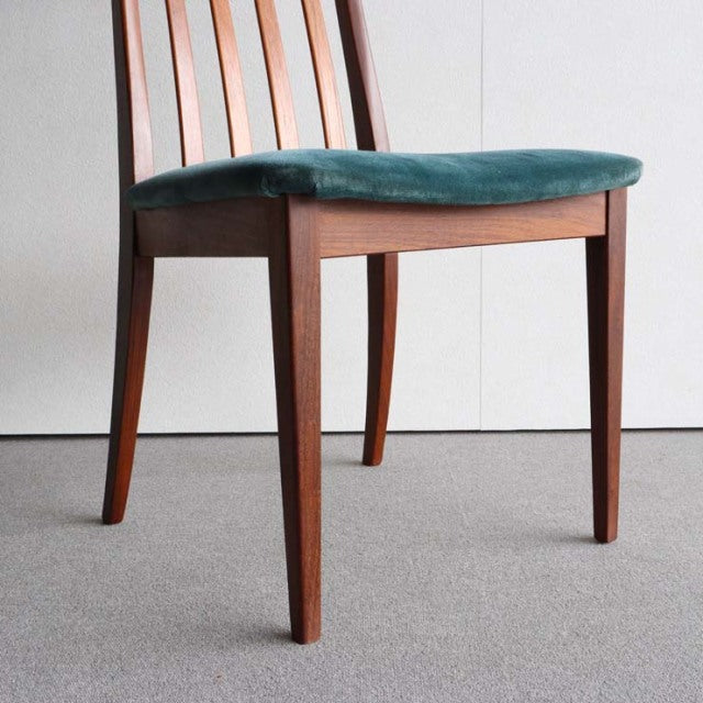 Mid-century British G-PLAN dining chair with teak frame, vintage wood grain, and teal upholstered seat.
