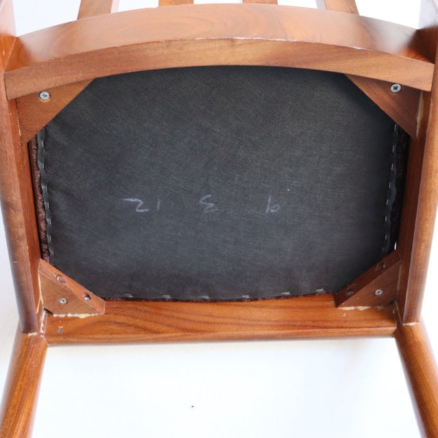 Underside view of Meredew teak dining chair showcasing solid wood frame and vintage British mid-century craftsmanship from.