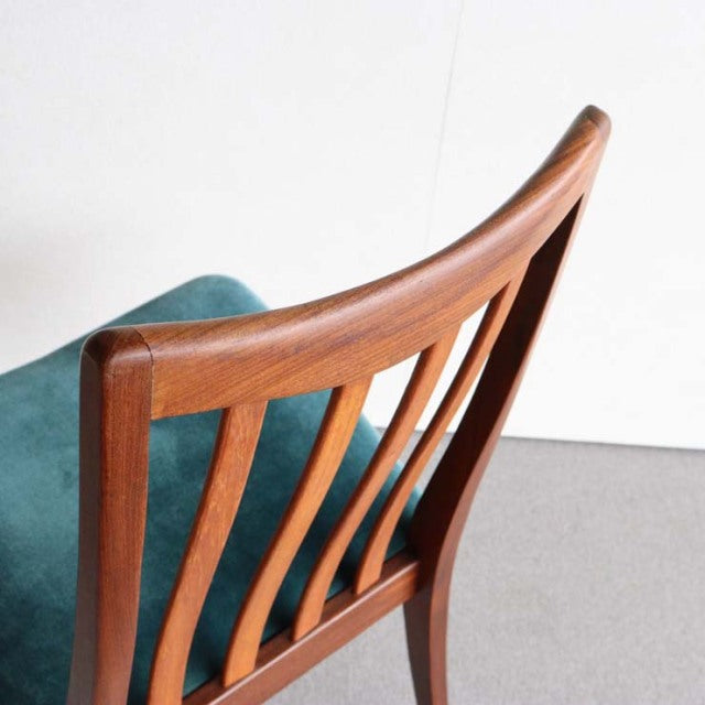 Mid-century British vintage G-Plan dining chair with curved teak backrest and teal upholstered seat.