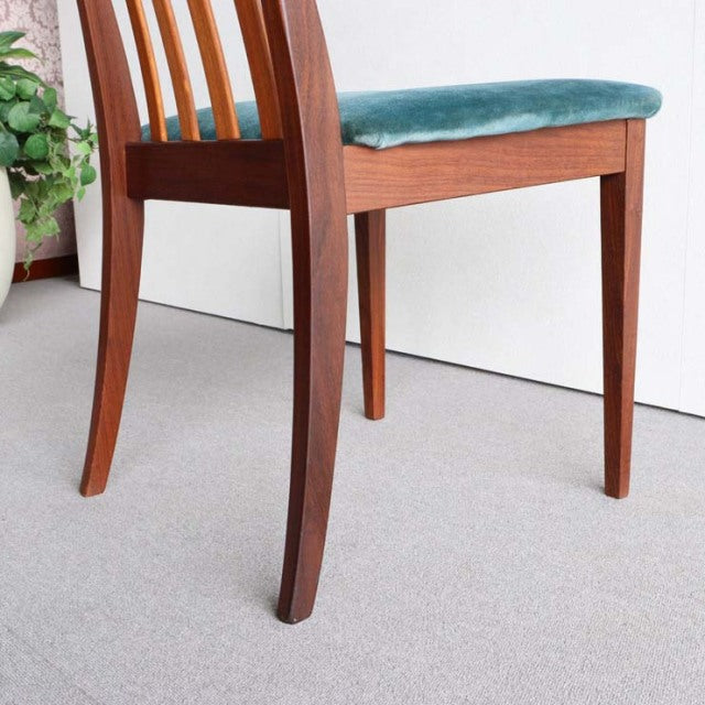 Vintage G-Plan British mid-century teak dining chair with curved legs and teal upholstered seat.
