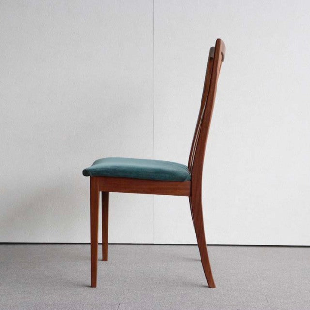 Mid-century British G-Plan dining chair with vintage teak frame and teal upholstered seat.