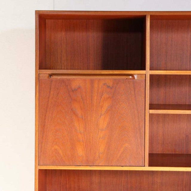 Vintage mid-century teak cabinet by British brand Macintosh with rich wood grain and clean lines.