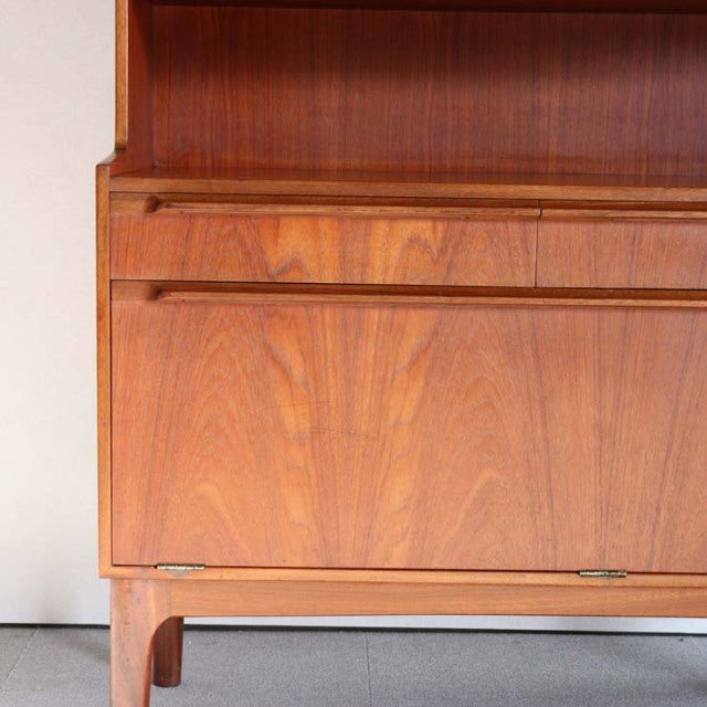Vintage British mid-century teak cabinet by A.H. McIntosh, showcasing rich wood grain and clean lines.
