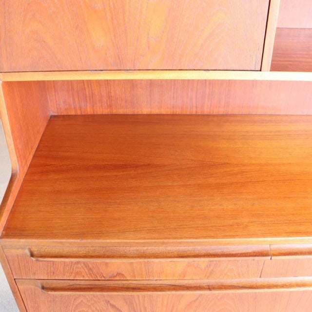 Vintage Macintosh teak cabinet with mid-century British design, visible wood grain, and sleek clean lines.
