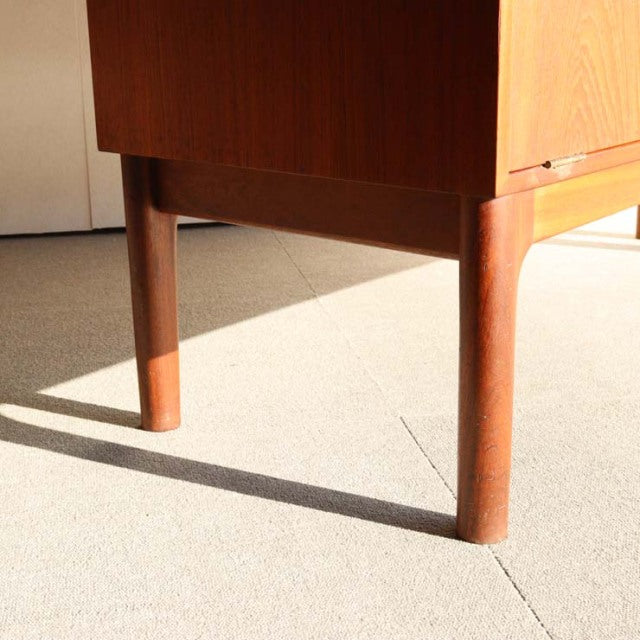 Mid-century British teak cabinet legs with warm wood grain and clean straight design from Macintosh, Denmark vintage style.