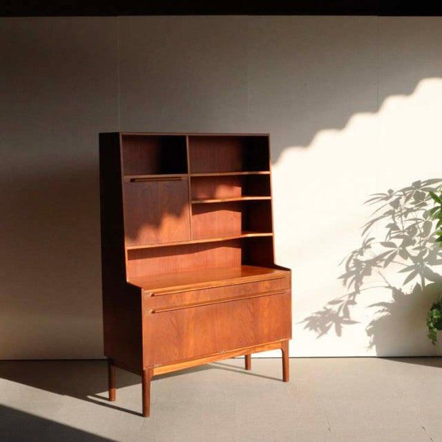 Vintage British mid-century teak cabinet by A.H. McIntosh with clean lines, open upper shelves, and sturdy tapered legs.
