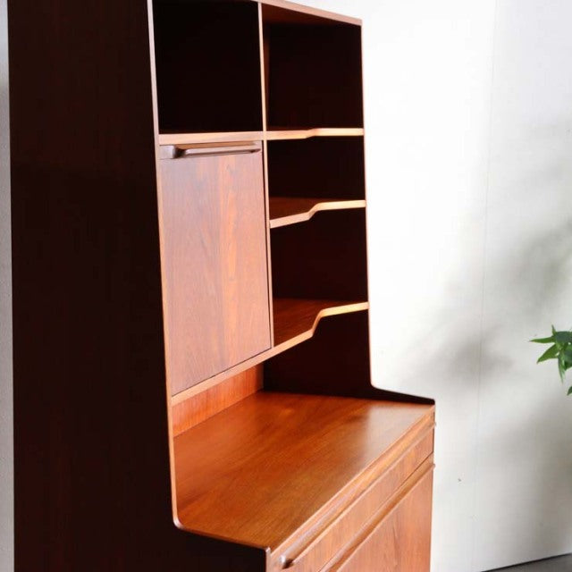 Vintage teak Macintosh mid-century cabinet with open shelving, wood grain details, and angled legs from Denmark.