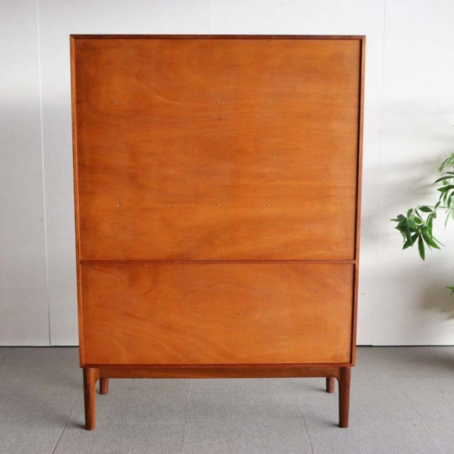 Vintage teak cabinet by A.H. McIntosh, British mid-century design with clean lines and visible wood grain.
