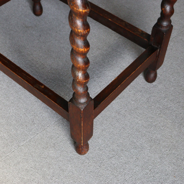 Vintage British oak side table leg with twisted barley sugar spindle and rich wood grain, mid-century style.