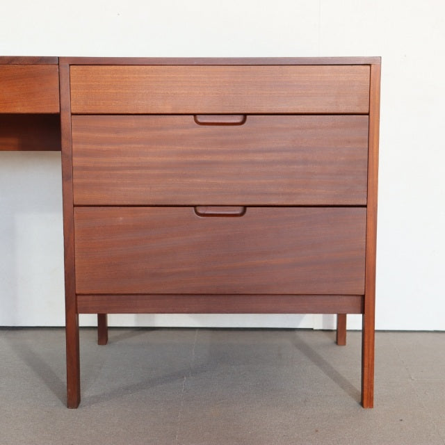Vintage Fyne Ladye teak sideboard with rich wood grain, mid-century British-Danish design, tapered legs, and recessed handles.