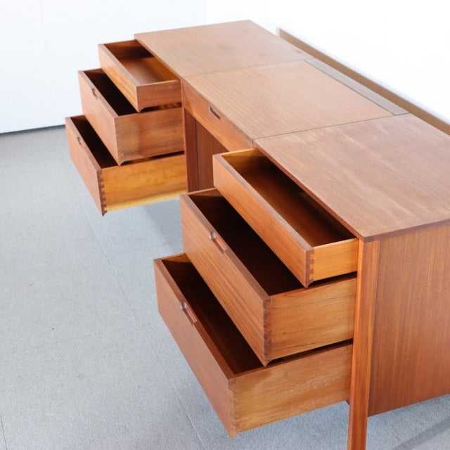 Vintage teak mid-century sideboard by Fyne Ladye with smooth wood grain, clean lines, and sturdy tapered legs.