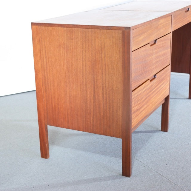 Mid-century British teak sideboard by Fyne Ladye Furniture with rich wood grain, clean lines, and tapered legs.