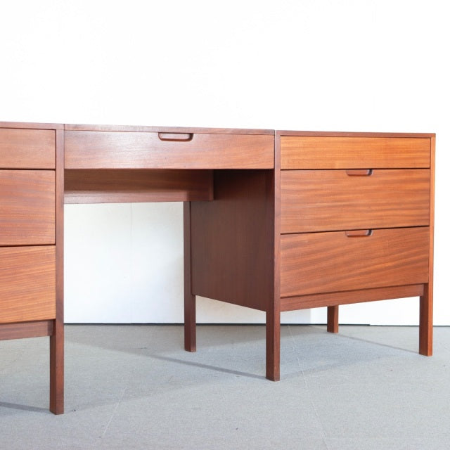 Mid-century British vintage teak sideboard with clean lines, visible wood grain, and slender legs.