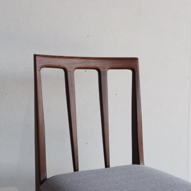 Mid-century British vintage dining chair by Younger with teak frame and vertical slat backrest, grey upholstered seat, and.