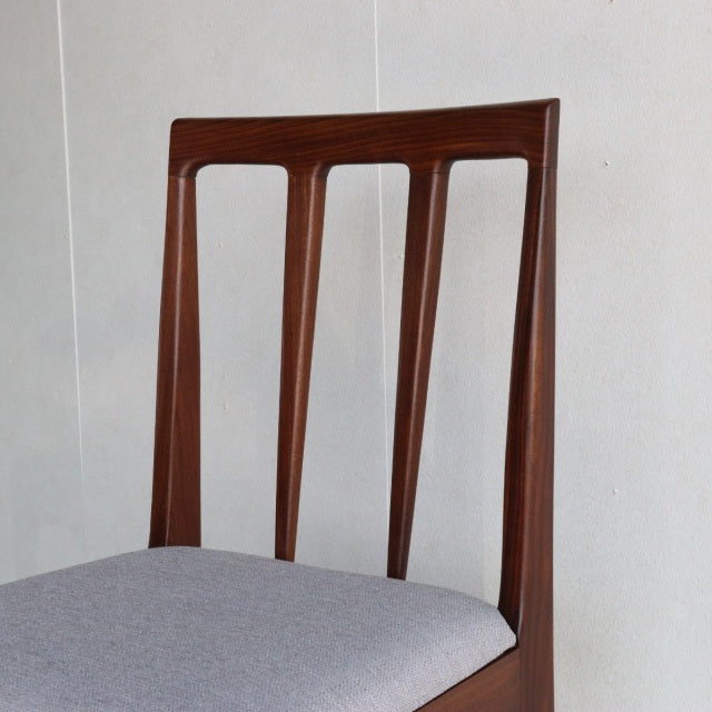 Vintage teak dining chair by Younger, British mid-century design with slim vertical back slats and gray upholstered seat,.