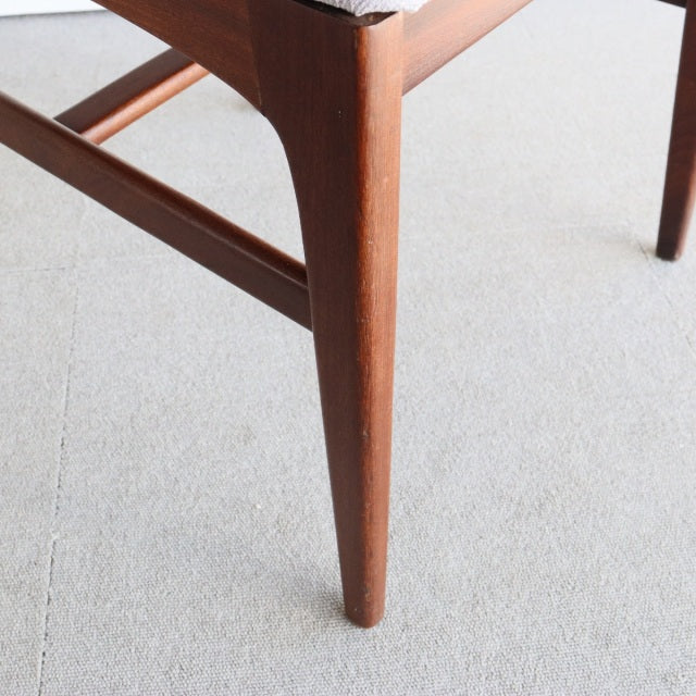 Mid-century teak dining chair leg with tapered profile and visible wood grain from British Younger design.
