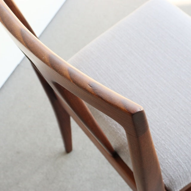 Vintage mid-century teak dining chair by Younger, British design with clean lines and light beige upholstered seat,.