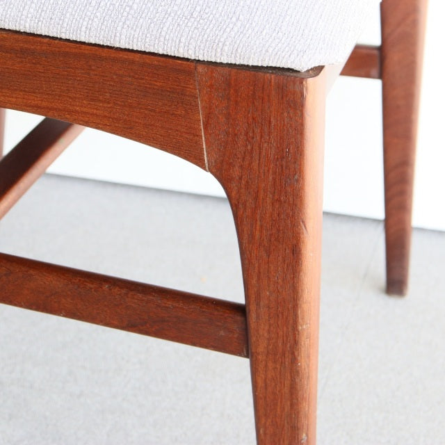 Close-up of vintage teak leg with smooth grain and mid-century British design by Younger, part of the Fonseca dining chair.