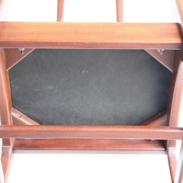 Underside of vintage teak dining chair by Younger, British mid-century design with exposed wood grain and sturdy frame.