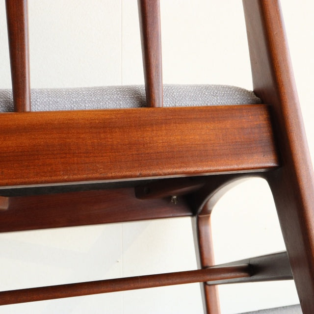 Close-up of vintage teak mid-century dining chair by Younger, showcasing British craftsmanship and wood grain details from.