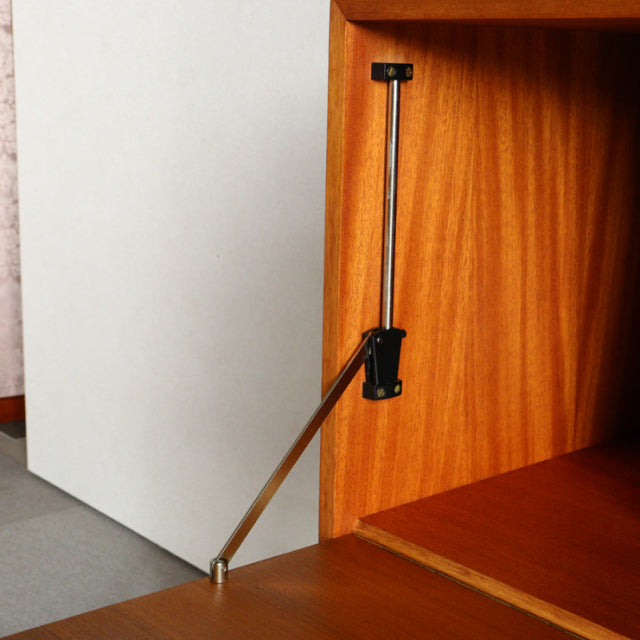 Mid-century vintage teak Ladderax unit shelf by Staples with visible wood grain and metal support hinge.