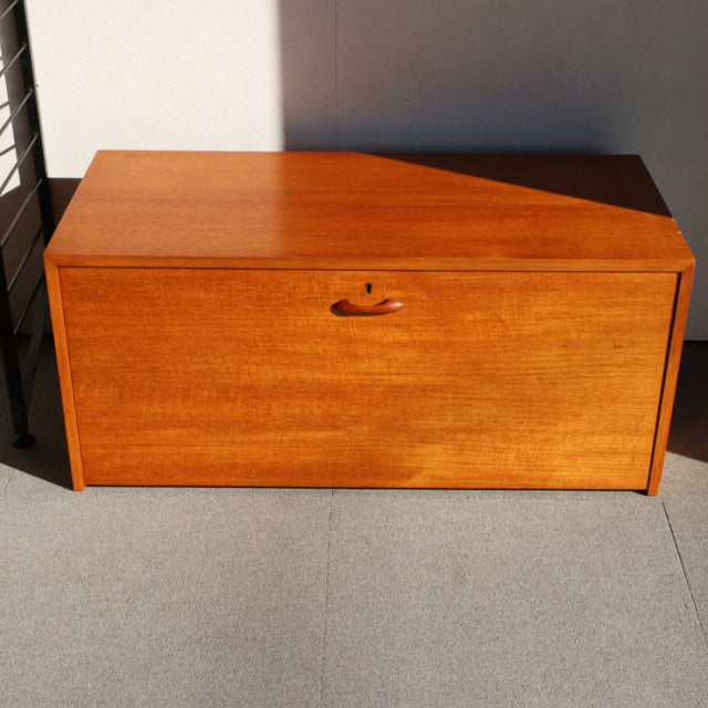 Vintage teak storage unit by Ladderax, British mid-century design with smooth wood grain and minimalist form.