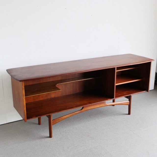 Mid-century British vintage teak sideboard by Dalescraft with open shelves, smooth wood grain, and angled legs from Denmark.