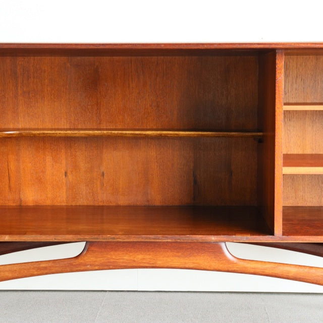 Mid-century British teak sideboard by Dalescraft with rich wood grain and sculpted base detailing from Denmark style.