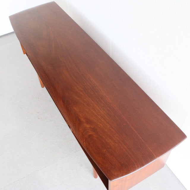 Mid-century British teak sideboard by Dalescraft with rich wood grain and sleek rectangular top.