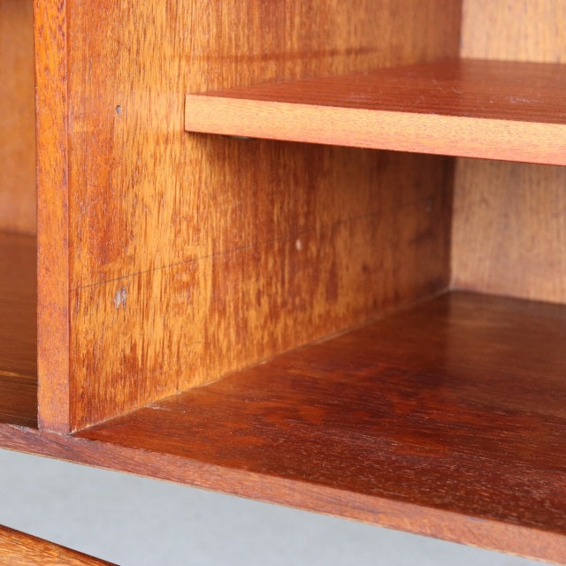 Close-up of vintage teak wood grain and interior shelf detail on British mid-century Dalescraft sideboard, showcasing rich.