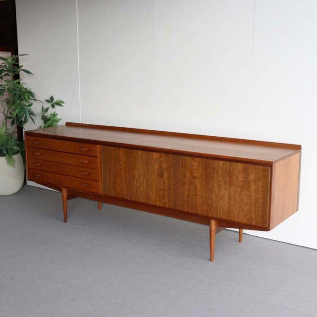 Mid-century vintage teak sideboard by Robert Heritage for Archie Shine, British design with clean lines, tapered legs, and.