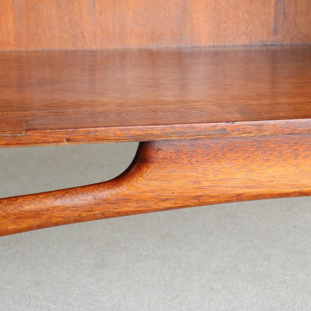 Mid-century British teak sideboard by Dalescraft with rich wood grain and sculpted leg detail.
